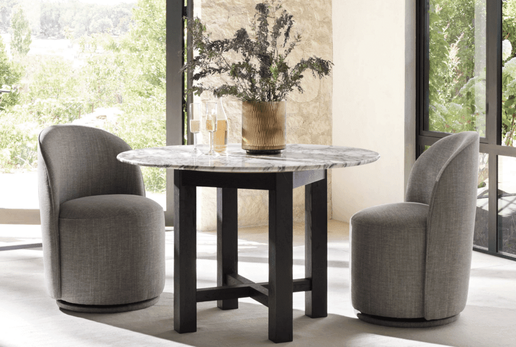 Arhaus Kira swivel dining chairs in Crypton Home Nomad Stone performance fabric easy clean spill resistant