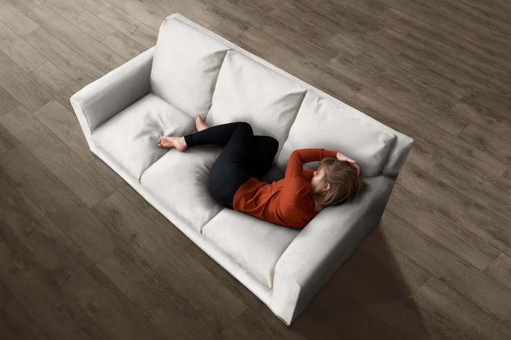 Woman on celliant fabric couch