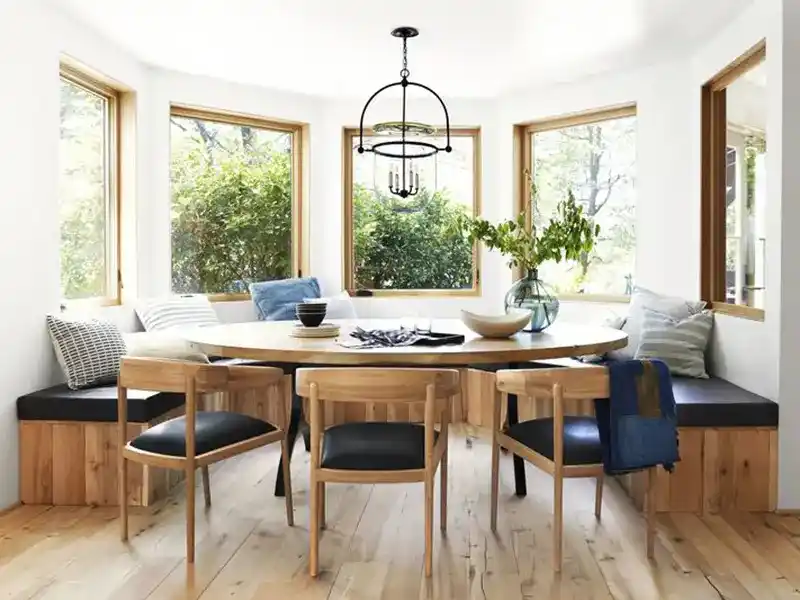 Dining room designed by Emily Henderson using luxury performance leather to upholster dining chairs