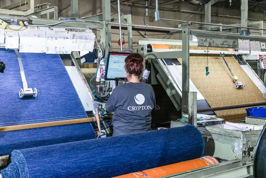 Made in USA upholstery fabric employee doing quality control at local textile mill in North Carolina