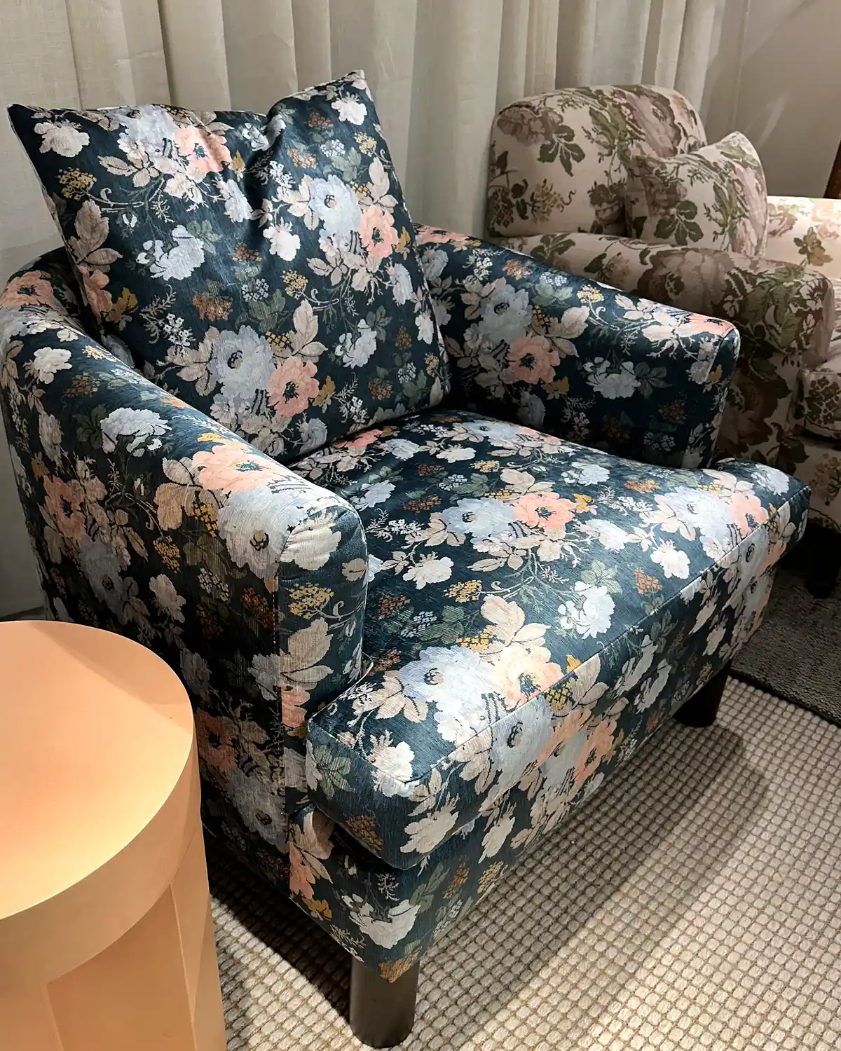 Crypton's new high performance fabric with a bold floral pattern upholstered on a Kim Salmela's new furniture collection at Norwalk Furniture in High Point.