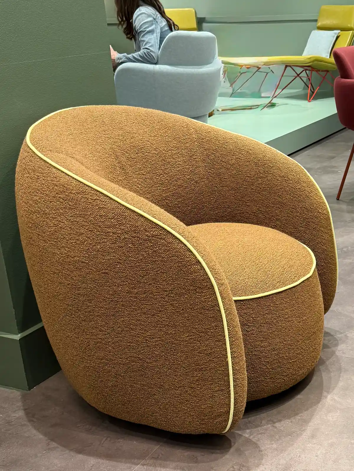 tan camel colors fabric chair with lime green contract piping seen at Neocon and Design Days