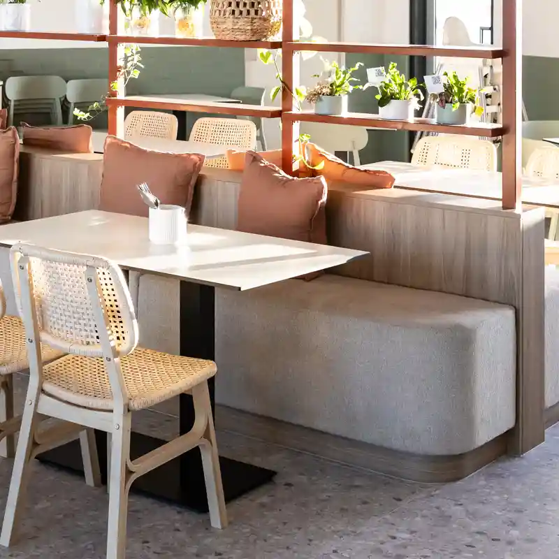 Find contract fabric for a commercial environment like this banquette seating that repels liquid