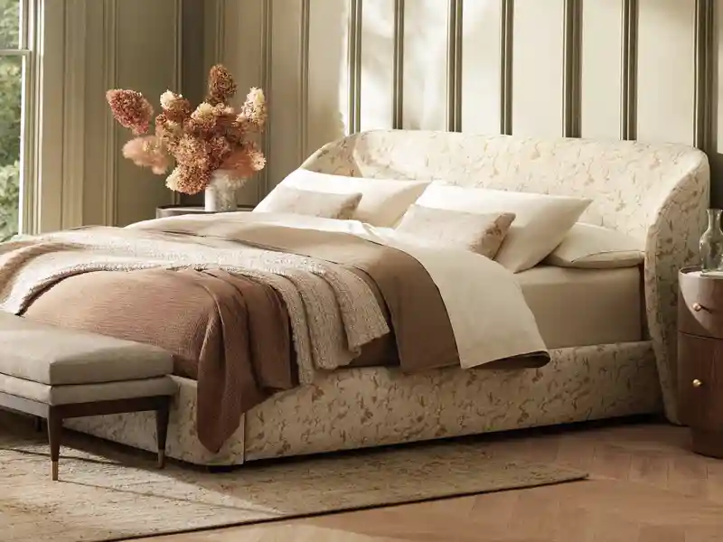 floral fabric pattern on bed frame from arhaus furniture store