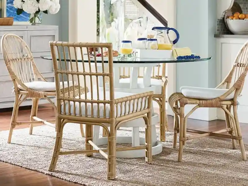 Rattan dining chairs with a coastal beach vibe