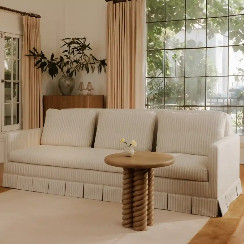 Striped fabric sofa with ruffle skirt base from Wayfair