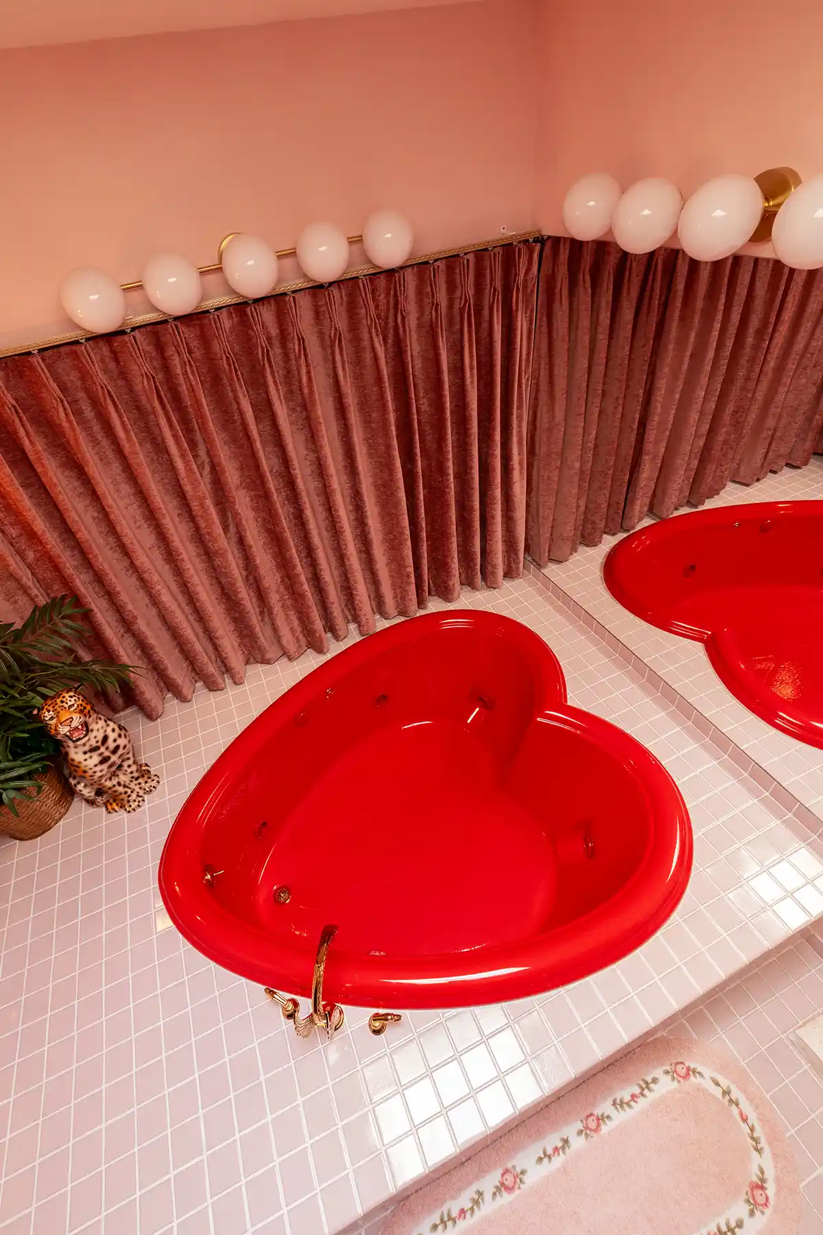 top down look at iconic heart shaped tub in bathroom