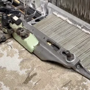 looming weaving upholstery fabric in textile mill closeup