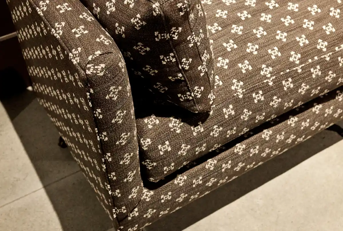 brown bench with diamond pattern upholstery fabric
