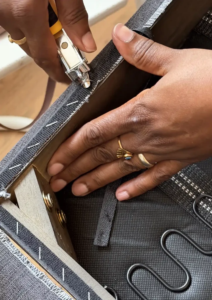 Close up of student removing staples from chair