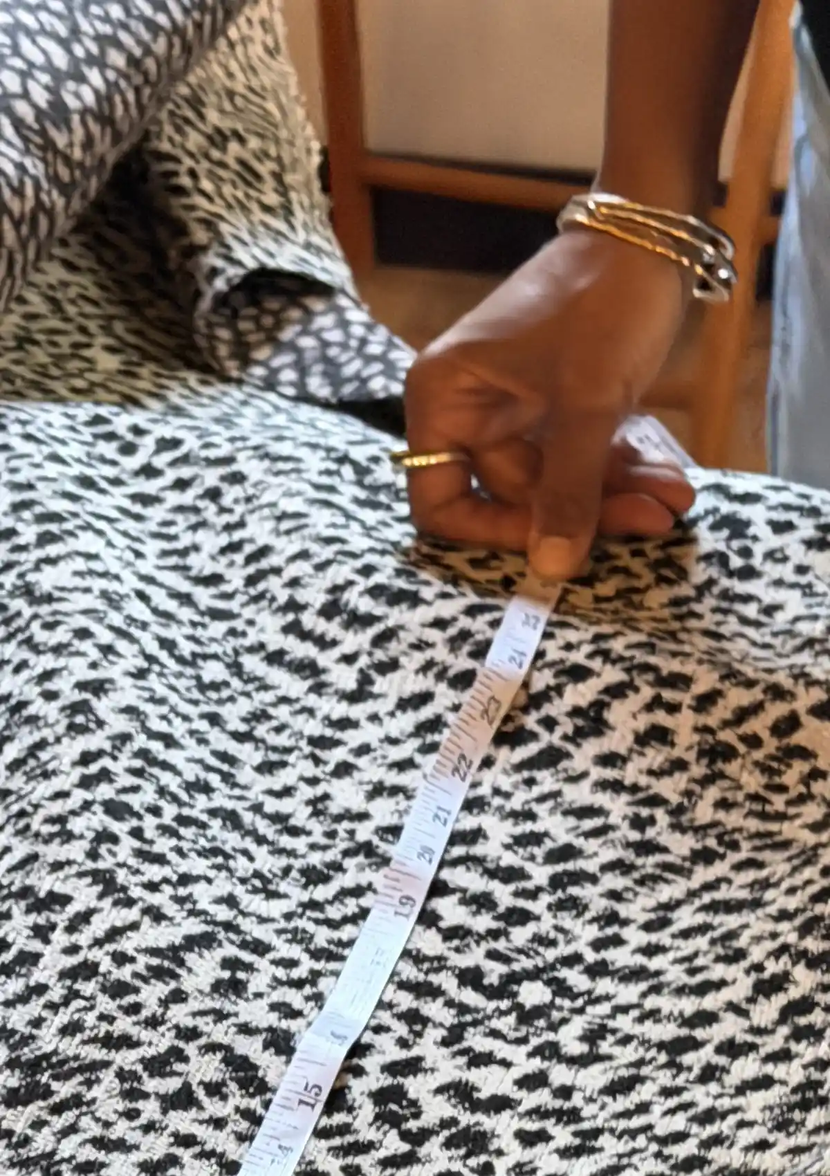Close up of measuring upholstery fabric