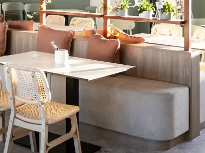 Find contract fabric for a commercial environment like this banquette seating that repels liquid